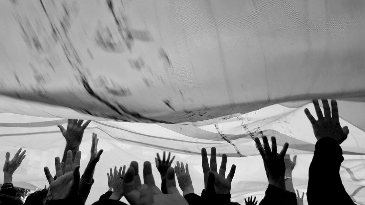 photologuephotos2024-12crowd-with-arms-raised-music-concert_1jpg