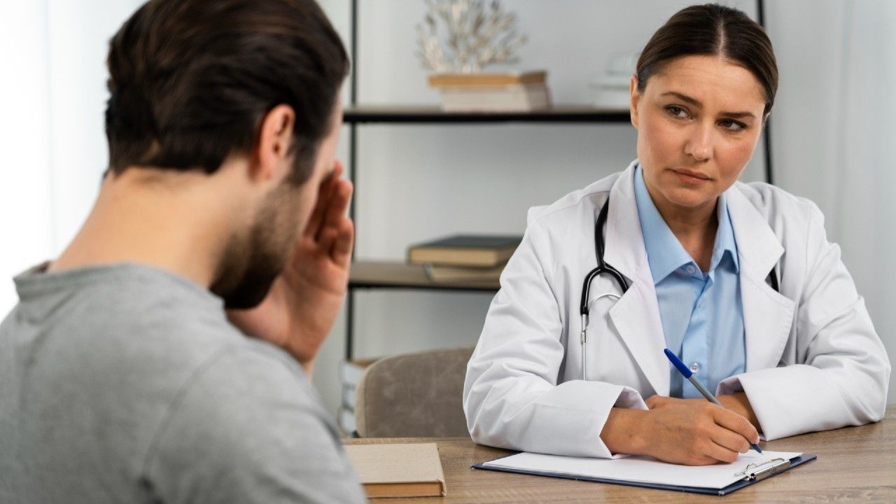 side-view-man-talking-doctor_1.jpg